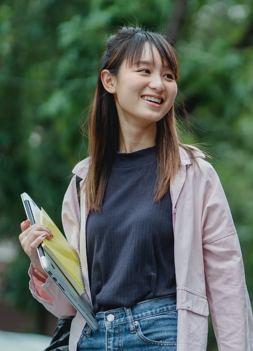 A VCE student walking to a tutoring session with study notes